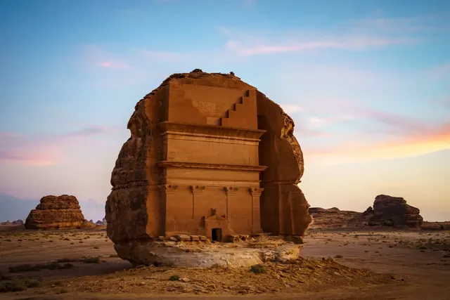 Rock-cut Nabataean tomb of Lihyan (Qasr al-Farid) at Hegra, AlUla, at golden hour