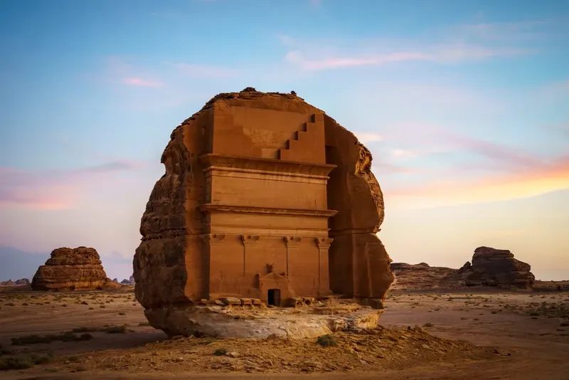 Rock-cut Nabataean tomb of Lihyan (Qasr al-Farid) at Hegra, AlUla, at golden hour