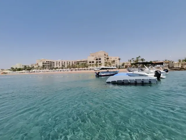 Aqaba's Red Sea beachfront resorts and boats across clear turquoise water