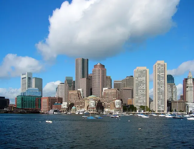 Boston waterfront skyline and Custom House Tower over moored sailboats