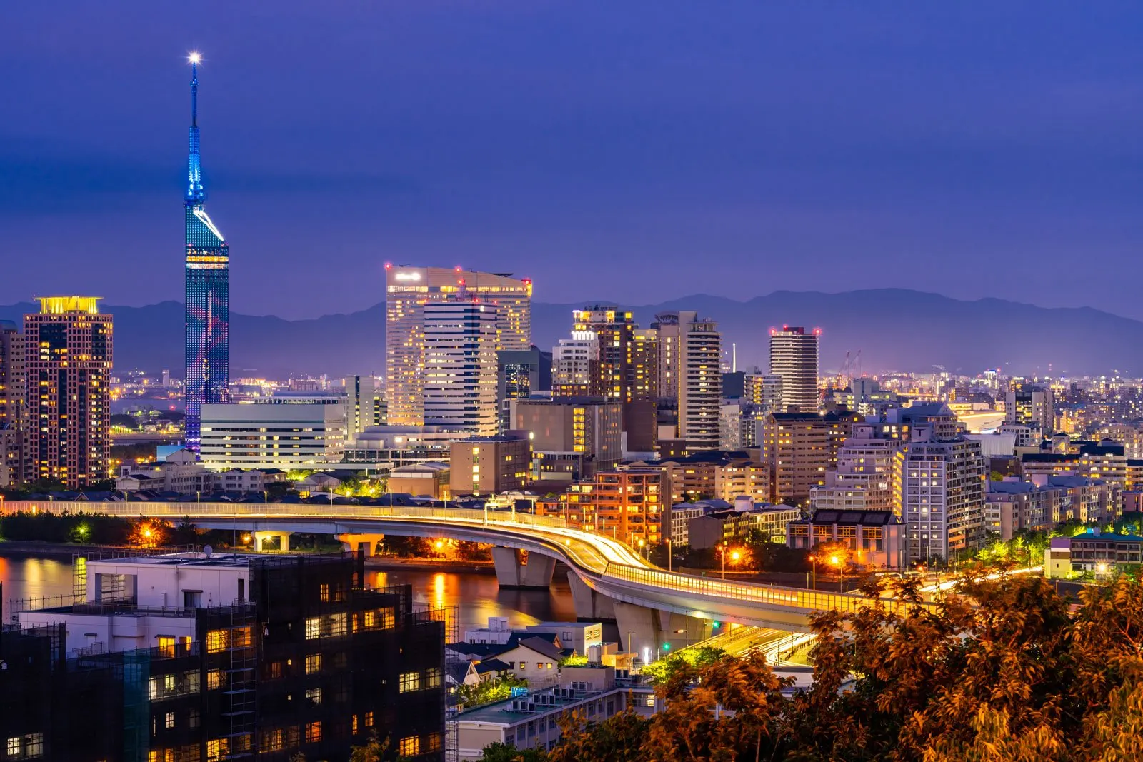 Fukuoka Tower and the city skyline glowing at dusk