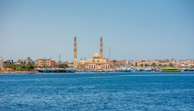 El Mina Mosque's twin minarets above Hurghada's Red Sea marina and moored boats