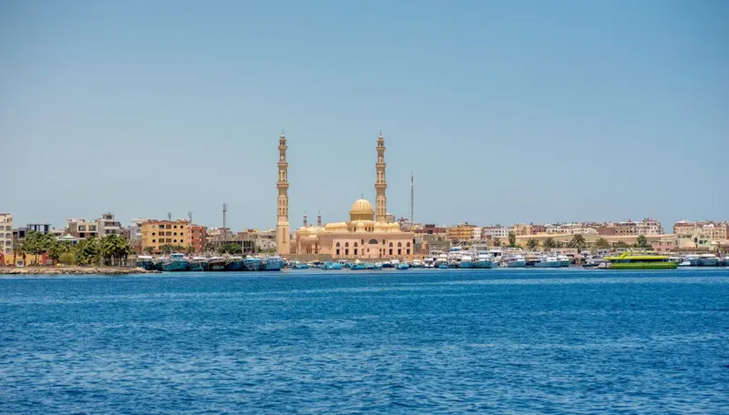 El Mina Mosque's twin minarets above Hurghada's Red Sea marina and moored boats