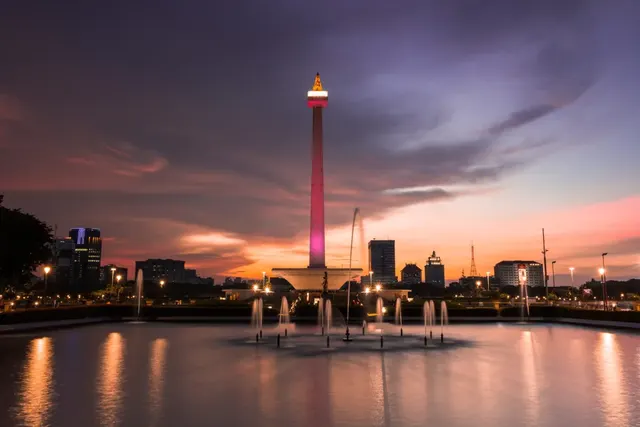 The National Monument (Monas) lit at dusk in Jakarta