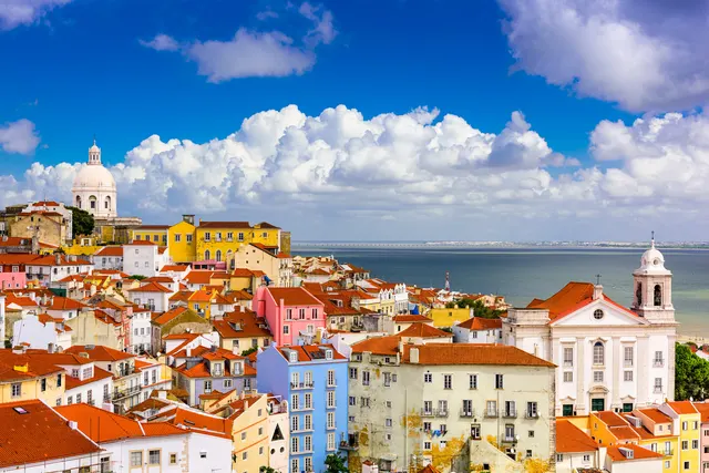 Colourful houses stacked across a Lisbon hillside