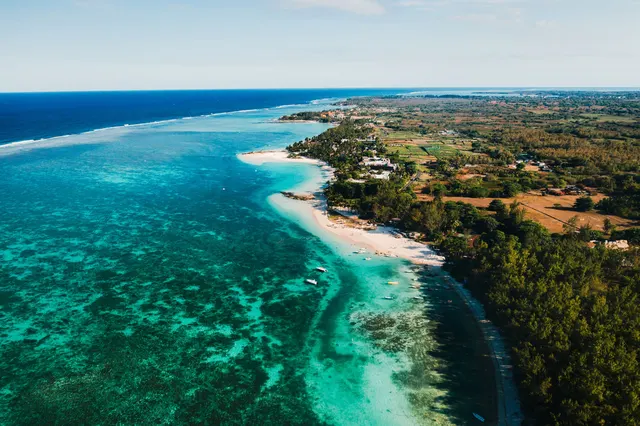 Aerial view of reef and forested coastline in Mauritius