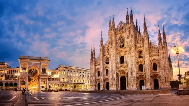 Milan's Duomo cathedral glowing at dusk