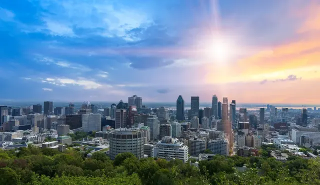 Downtown Montreal skyline seen from the Mount Royal lookout at sunset