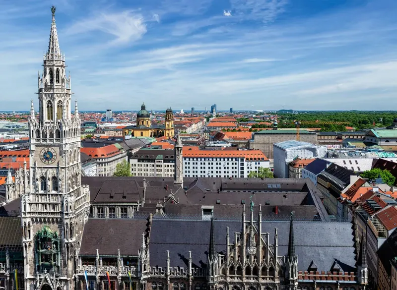 Munich's New Town Hall tower rising above the old town's red rooftops