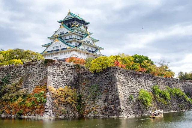 Osaka Castle above its stone walls and moat