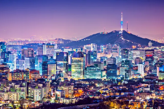 Seoul's neon-lit streets beneath N Seoul Tower