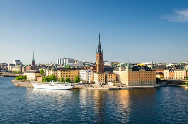 Riddarholmen Church's iron spire above Stockholm's Gamla Stan on the water